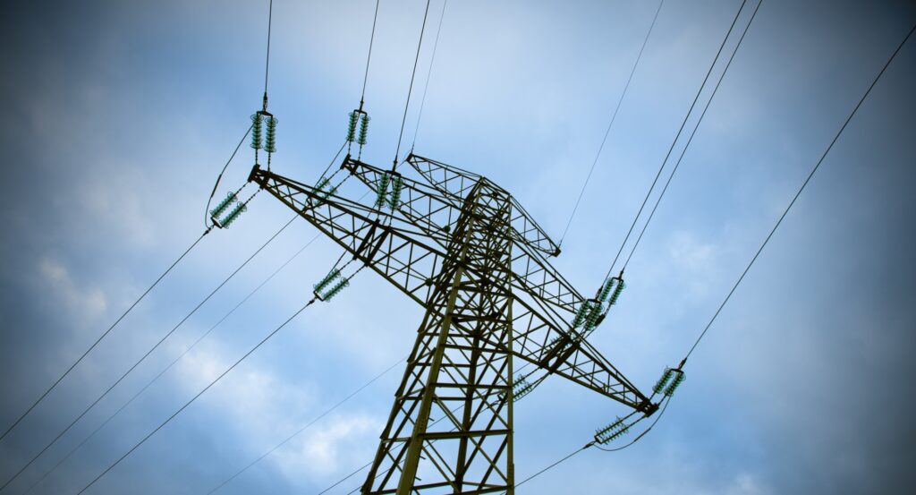 ergon demand based tariff electricity pylon against a blue sky