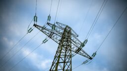 ergon demand based tariff electricity pylon against a blue sky